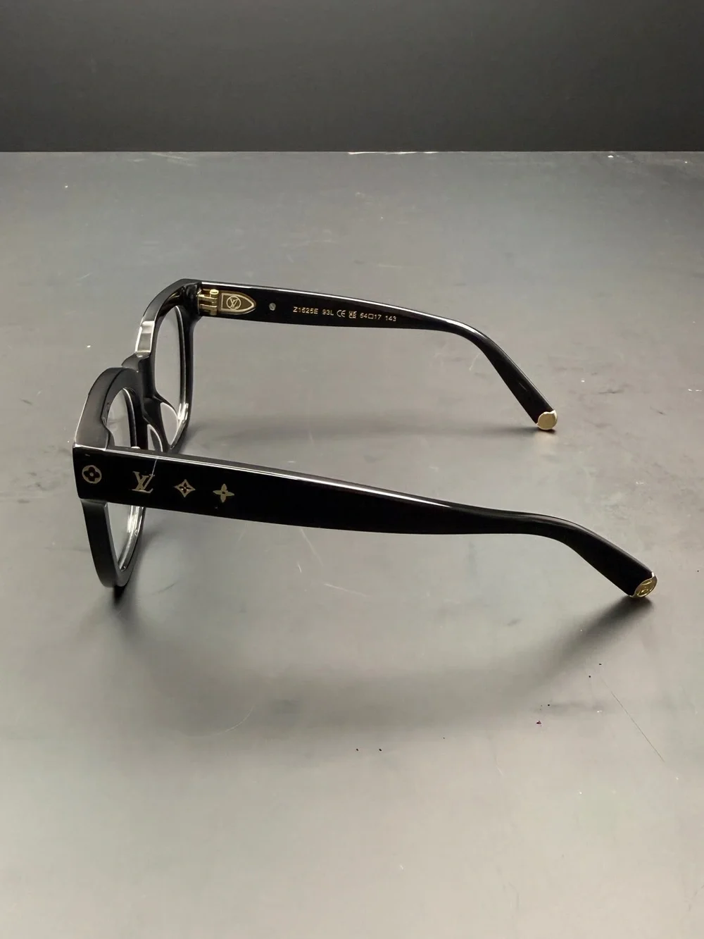 Louis Vuitton Black Frame Glasses with Gold Accents